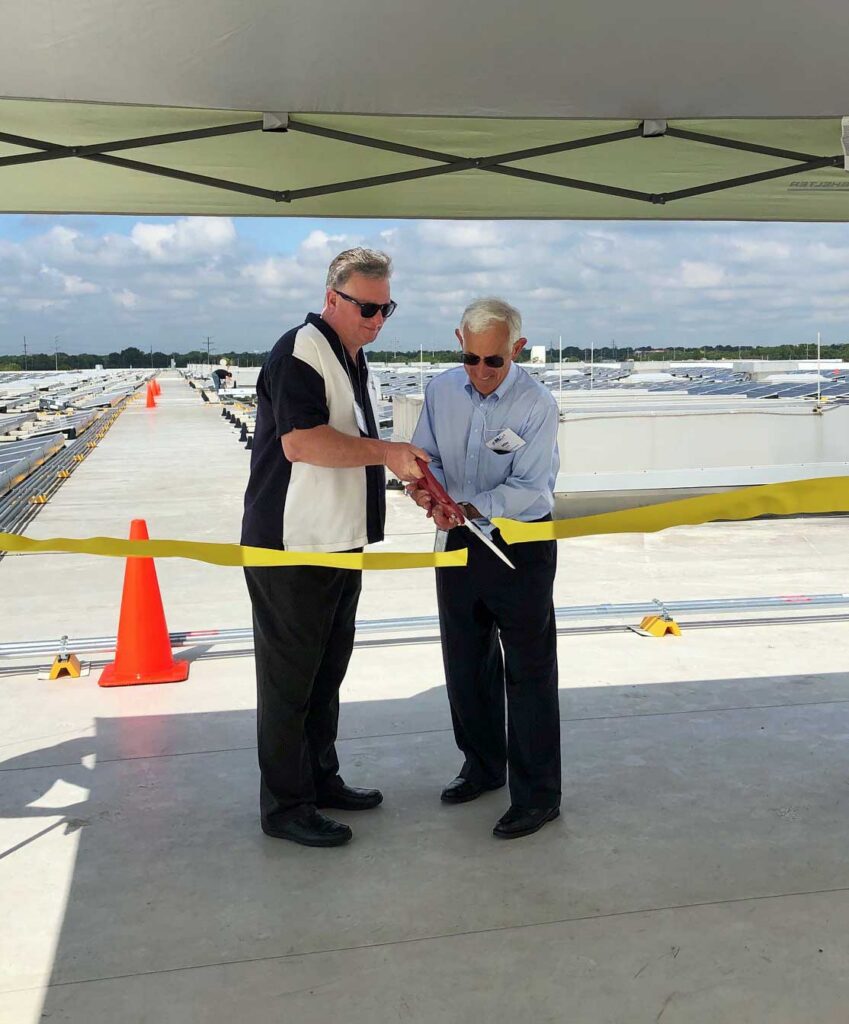 Mike and the mayor at the ribbon cutting ceremony for our solar panel installation.